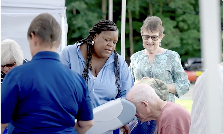 People at community health event