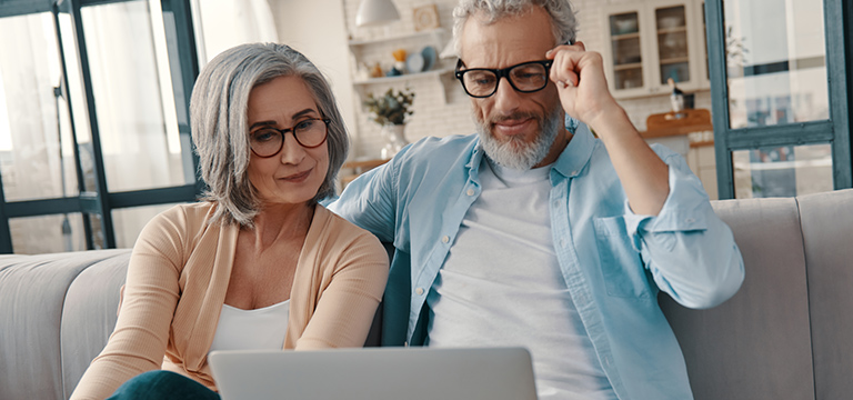 Couple looking at laptop together